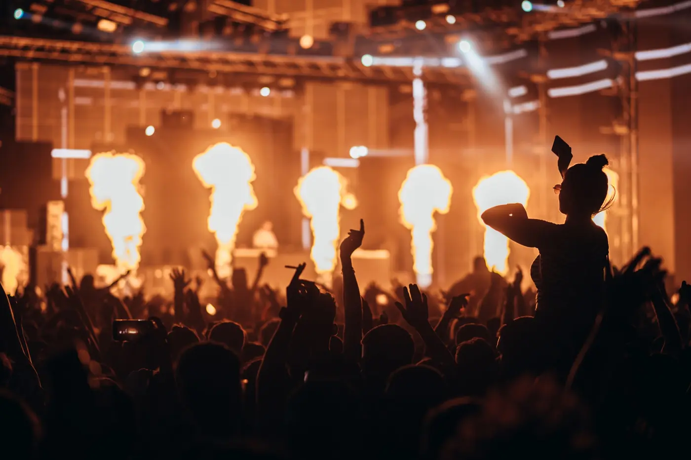 Flame cannons firing over a festival crowd